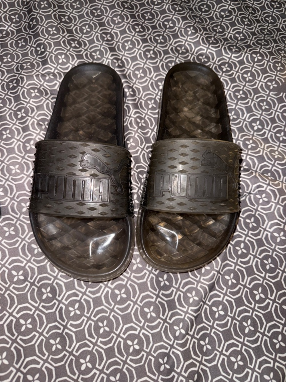 Fenty x Puma Black Rubber Slide Sandals with Embossed Logo. Limited edition